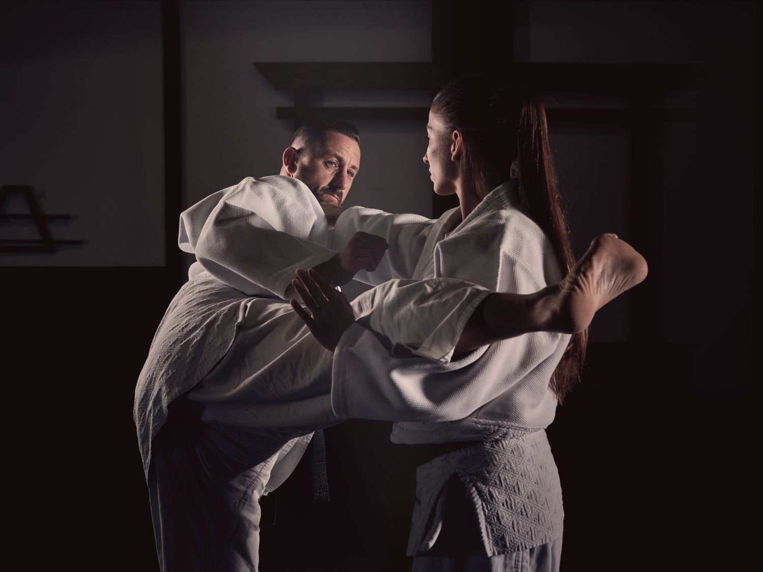 woman and man doing martial arts